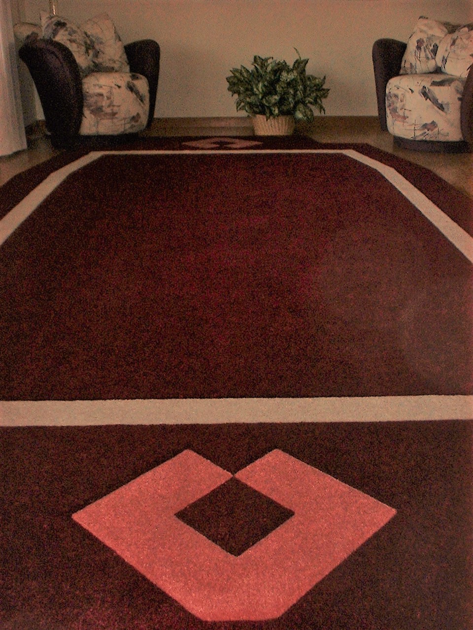 Geometric patterns work in many spaces and with various styles of furniture, as evidenced by this custom area rug.